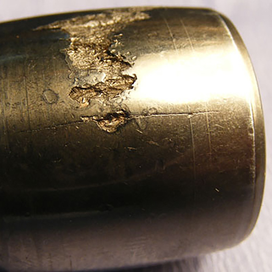 A spherical roller damaged as a result of flaking and fatigue