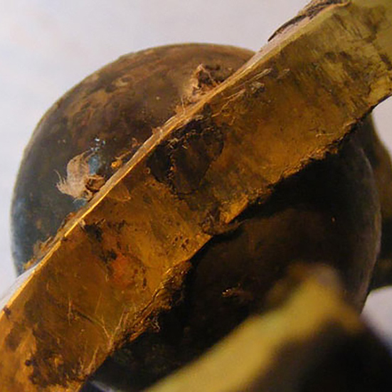 Wear in a brass cage pocket due to low lubrication