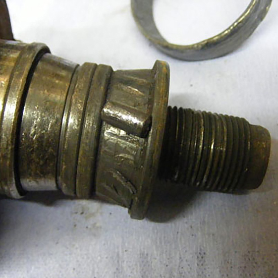 Tapered roller assembly with skewed and friction welded roller on one cone caused by assembly with an excess of end float